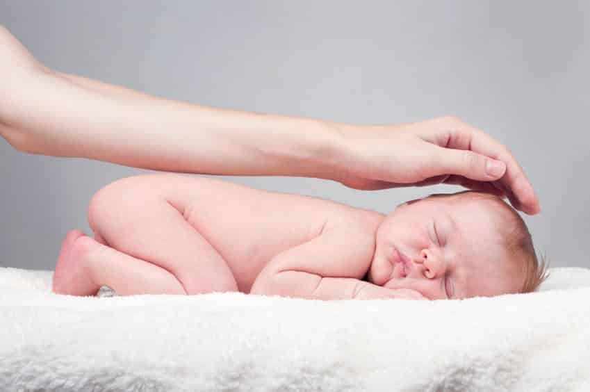 Baby 1 Hand Covering it From Left