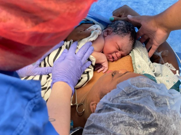New parent after c-section birthing experience skink to skin